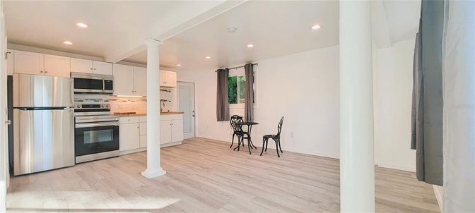Interior, Kitchen, Recessed Lighting, Stainless Steel Appliances, Wood Texture Flooring