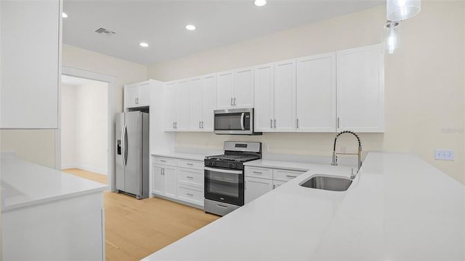 Interior, Kitchen, Pendant Lights, Recessed Lighting, Stainless Steel Appliances, Wood Texture Flooring
