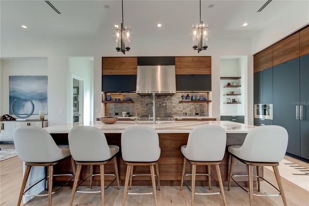 Interior, Kitchen, Pendant Lights, Recessed Lighting, Stainless Steel Appliances, Stone Walls, Wood Texture Flooring
