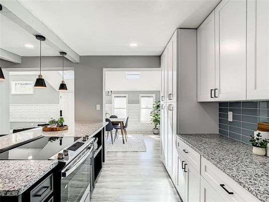 Dining room, Interior, Kitchen, Pendant Lights, Recessed Lighting, Stainless Steel Appliances, Wood Texture Flooring