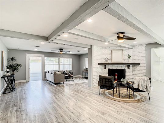 Fireplace, Interior, Living room, Recessed Lighting, Stone Walls, Wood Texture Flooring