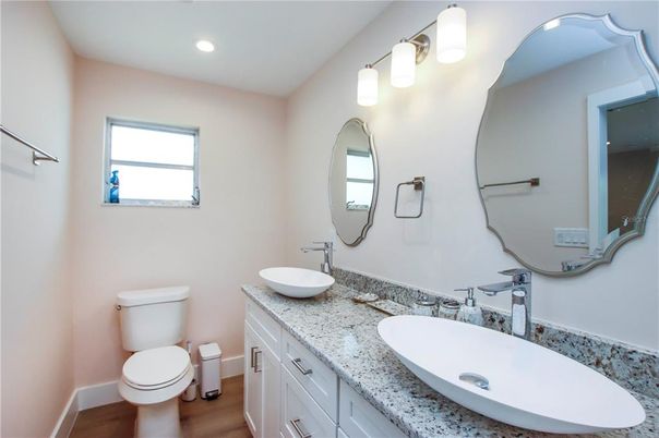 Bathroom, Dual Sink Vanities, Interior, Recessed Lighting, Wood Texture Flooring