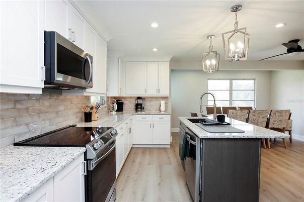 Interior, Kitchen, Pendant Lights, Recessed Lighting, Stainless Steel Appliances, Wood Texture Flooring