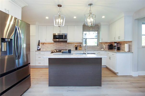 Interior, Kitchen, Pendant Lights, Recessed Lighting, Stainless Steel Appliances, Wood Texture Flooring