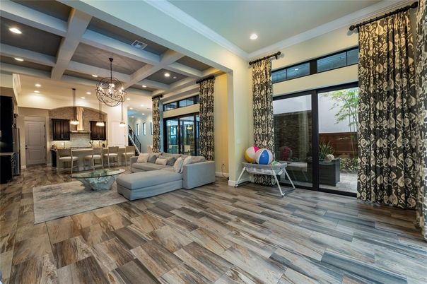 Chandelier, Interior, Kitchen, Living room, Pendant Lights, Recessed Lighting, Stainless Steel Appliances, Wood Texture Flooring
