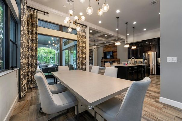 Dining room, Interior, Kitchen, Pendant Lights, Recessed Lighting, Stainless Steel Appliances, Wood Texture Flooring