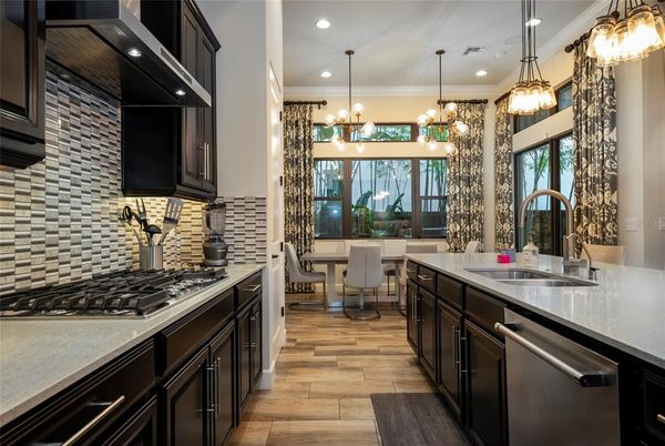 Dining room, Interior, Kitchen, Pendant Lights, Recessed Lighting, Stainless Steel Appliances, Wood Texture Flooring