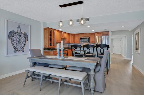 Dining room, Interior, Kitchen, Pendant Lights, Recessed Lighting, Stainless Steel Appliances, Wood Texture Flooring
