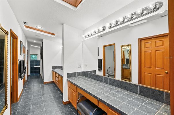 Bathroom, Dual Sink Vanities, Interior, Recessed Lighting, Tile Countertops
