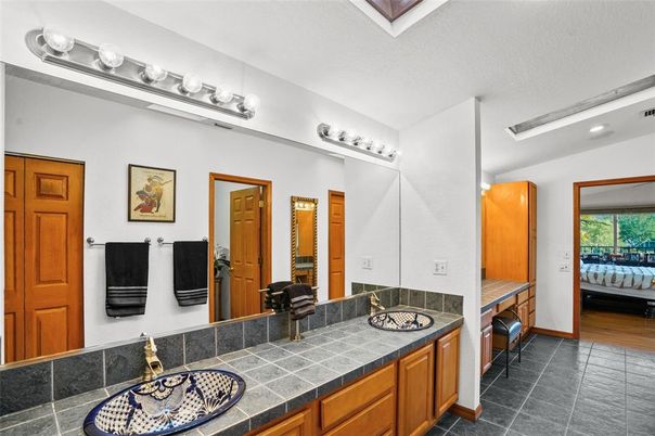 Bathroom, Dual Sink Vanities, Interior, Recessed Lighting, Tile Countertops