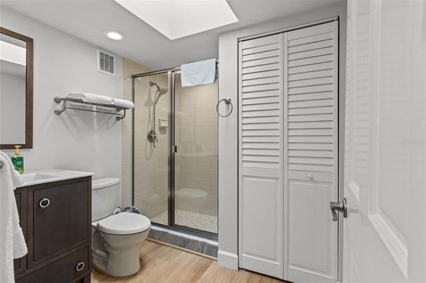 Bathroom, Glass Shower, Interior, Recessed Lighting, Wood Texture Flooring