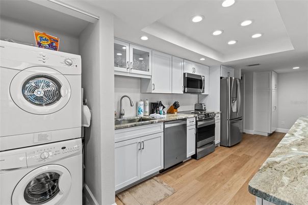 Interior, Kitchen, Recessed Lighting, Washer, Wood Texture Flooring