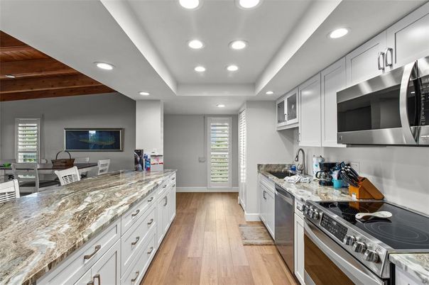 Dining room, Interior, Kitchen, Recessed Lighting, Stainless Steel Appliances, Wooden Ceilings, Wood Texture Flooring