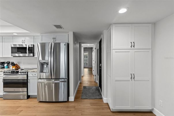 Interior, Kitchen, Recessed Lighting, Stainless Steel Appliances, Wood Texture Flooring