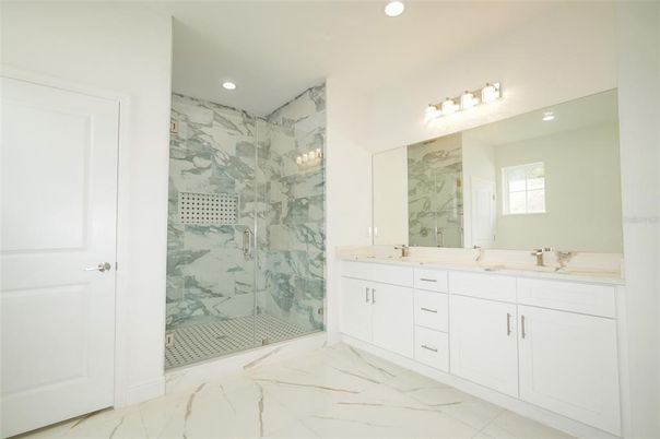 Bathroom, Dual Sink Vanities, Glass Shower, Interior, Marble, Marble Walls, Recessed Lighting