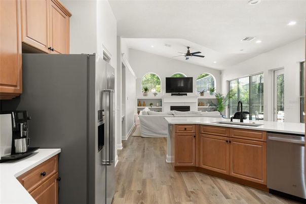 Fireplace, Interior, Kitchen, Living room, Recessed Lighting, Stainless Steel Appliances, Wood Texture Flooring