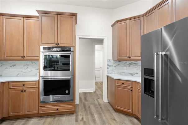 Interior, Kitchen, Marble Walls, Stainless Steel Appliances, Wood Texture Flooring