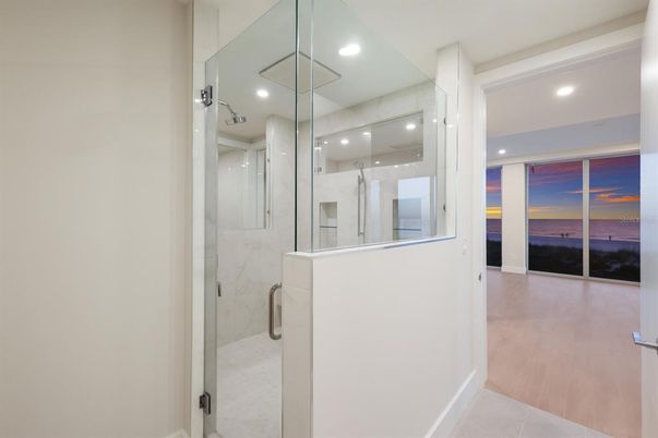 Bathroom, Glass Shower, Interior, Marble Walls, Recessed Lighting, Wood Texture Flooring