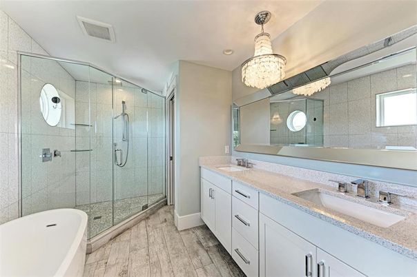Bathroom, Chandelier, Dual Sink Vanities, Glass Shower, Interior, Recessed Lighting, Wood Texture Flooring