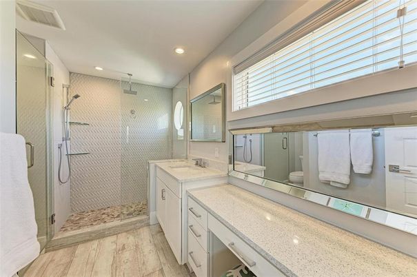 Bathroom, Dual Sink Vanities, Glass Shower, Interior, Recessed Lighting, Wood Texture Flooring