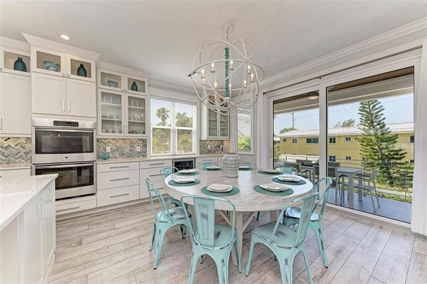 Chandelier, Dining room, Interior, Kitchen, Recessed Lighting, Stainless Steel Appliances, Wood Texture Flooring