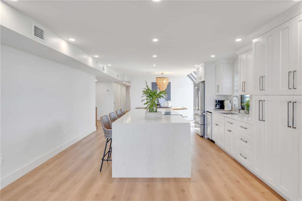 Chandelier, Dining room, Interior, Kitchen, Recessed Lighting, Stainless Steel Appliances, Wood Texture Flooring