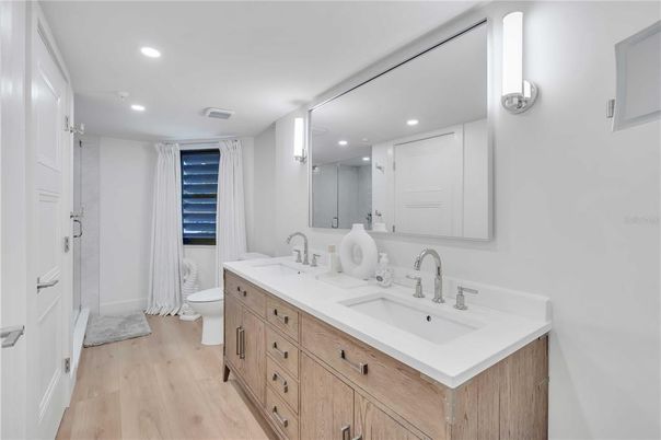Bathroom, Dual Sink Vanities, Interior, Recessed Lighting, Wood Texture Flooring