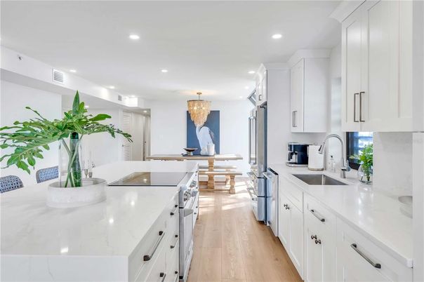 Chandelier, Dining room, Interior, Kitchen, Recessed Lighting, Stainless Steel Appliances, Wood Texture Flooring