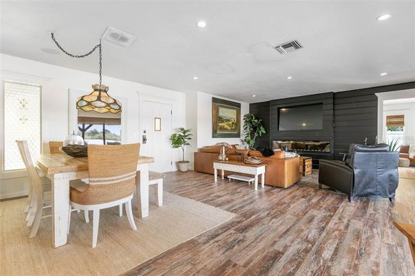Dining room, Fireplace, Interior, Living room, Pendant Lights, Recessed Lighting, Wood Texture Flooring