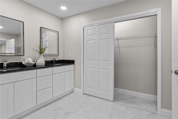 Bathroom, Dual Sink Vanities, Interior, Marble, Recessed Lighting, Walk-in Closets