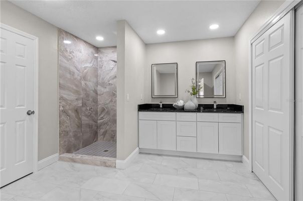 Bathroom, Dual Sink Vanities, Glass Shower, Interior, Marble, Marble Walls, Recessed Lighting