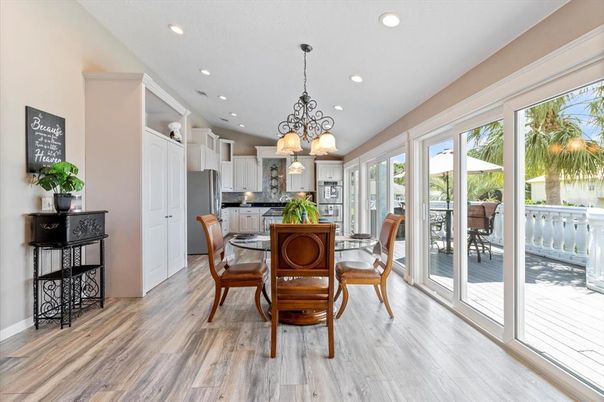 Chandelier, Dining room, Interior, Kitchen, Recessed Lighting, Stainless Steel Appliances, Wood Texture Flooring