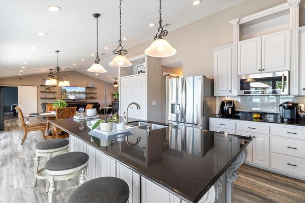 Dining room, Interior, Kitchen, Pendant Lights, Recessed Lighting, Stainless Steel Appliances, Wood Texture Flooring