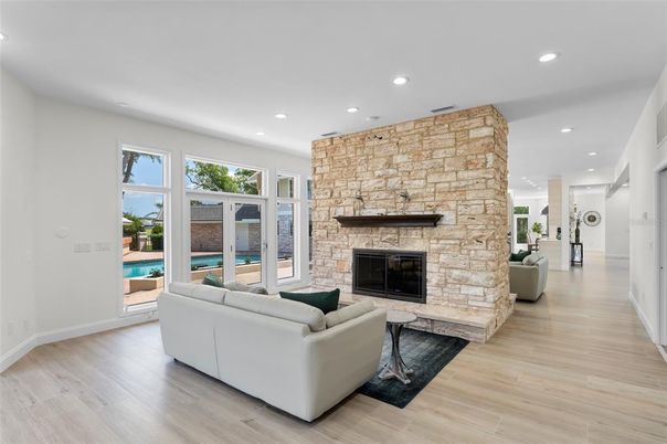 Fireplace, Interior, Living room, Recessed Lighting, Stone Walls, Wood Texture Flooring