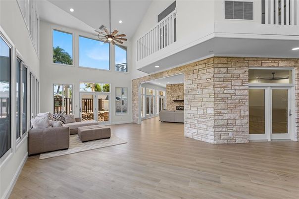 Fireplace, Interior, Living room, Recessed Lighting, Stone Walls, Wood Texture Flooring