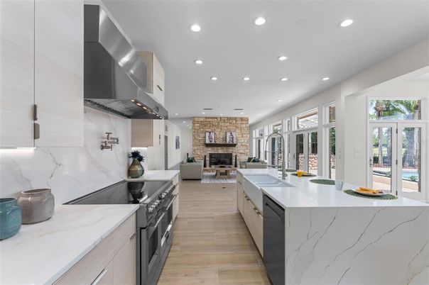 Fireplace, Interior, Kitchen, Living room, Recessed Lighting, Stainless Steel Appliances, Stone Walls, Wood Texture Flooring