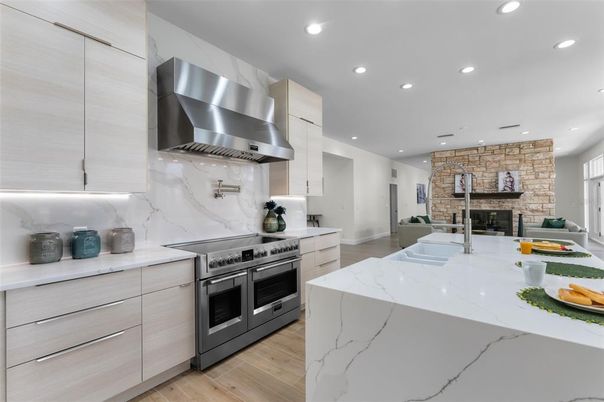 Interior, Kitchen, Recessed Lighting, Stainless Steel Appliances, Stone Walls, Wood Texture Flooring