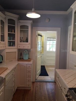 Interior, Kitchen, Pendant Lights, Tile Countertops, Wood Texture Flooring