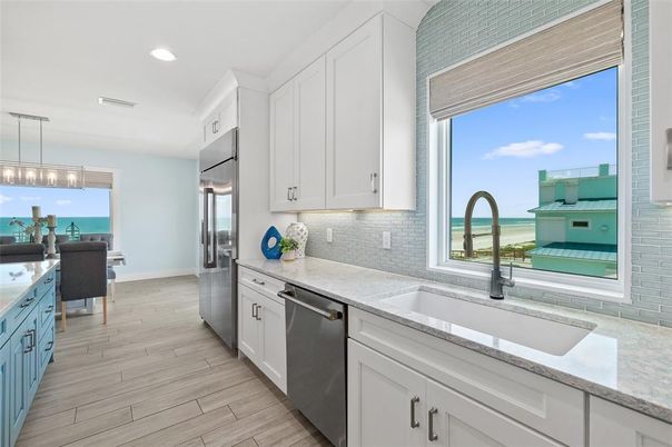 Dining room, Interior, Kitchen, Pendant Lights, Recessed Lighting, Stainless Steel Appliances, Water, Wood Texture Flooring
