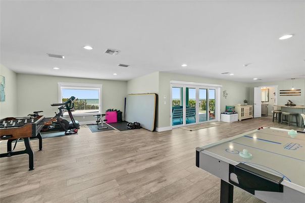Fitness Equipment, Game Room, Interior, Pendant Lights, Recessed Lighting, Wood Texture Flooring