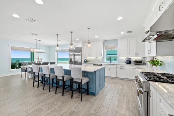 Dining room, Interior, Kitchen, Pendant Lights, Recessed Lighting, Stainless Steel Appliances, Water, Wood Texture Flooring