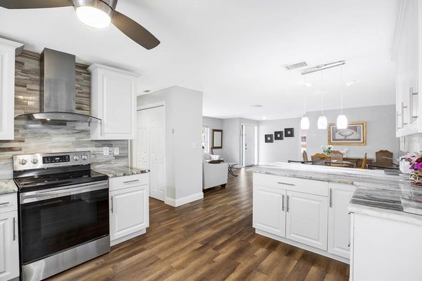 Dining room, Interior, Kitchen, Pendant Lights, Stainless Steel Appliances, Wood Texture Flooring