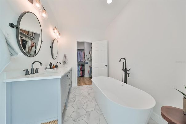 Bathroom, Dual Sink Vanities, Free Standing Baths, Interior, Marble, Recessed Lighting, Wood Texture Flooring