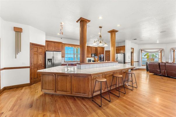 Interior, Kitchen, Living room, Pendant Lights, Recessed Lighting, Stainless Steel Appliances, Tile Countertops, Wood Texture Flooring