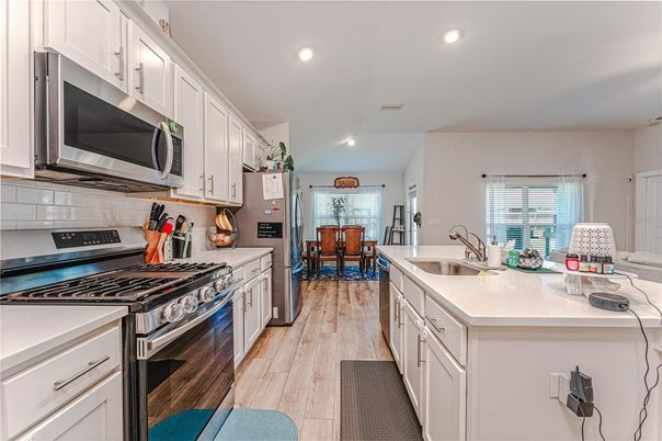 Dining room, Interior, Kitchen, Recessed Lighting, Stainless Steel Appliances, Wood Texture Flooring