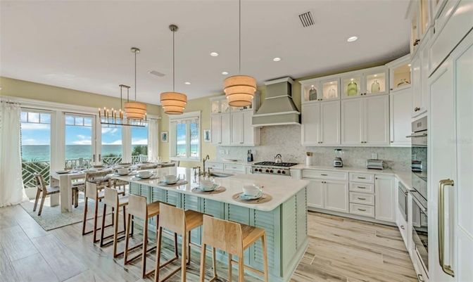 Dining room, Interior, Kitchen, Pendant Lights, Recessed Lighting, Stainless Steel Appliances, Water, Wood Texture Flooring