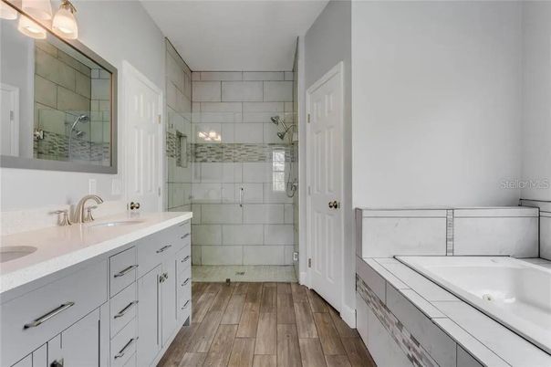 Bathroom, Dual Sink Vanities, Glass Shower, Interior, Tile Countertops, Wood Texture Flooring
