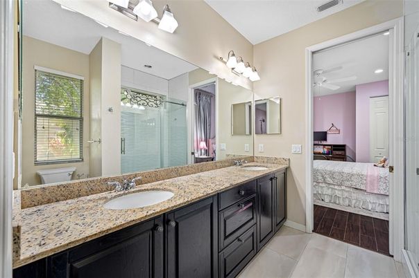 Bathroom, Bedroom, Dual Sink Vanities, Glass Shower, Interior, Recessed Lighting, Wood Texture Flooring