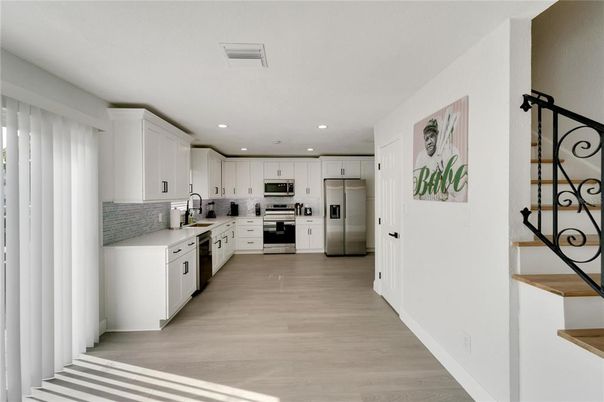 Interior, Kitchen, Recessed Lighting, Stainless Steel Appliances, Wood Texture Flooring
