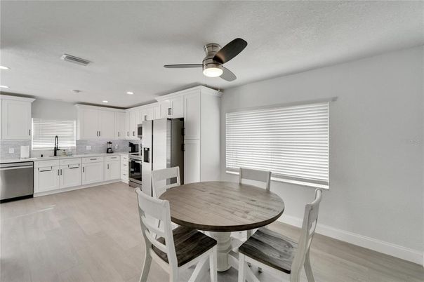 Dining room, Interior, Kitchen, Recessed Lighting, Stainless Steel Appliances, Wood Texture Flooring